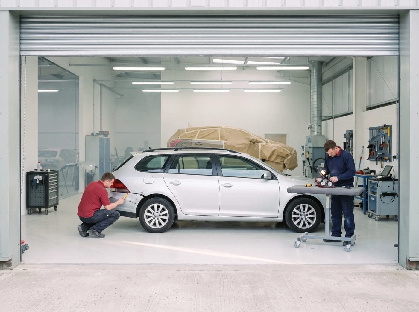 A collision repair centre seen through its open workshop door
